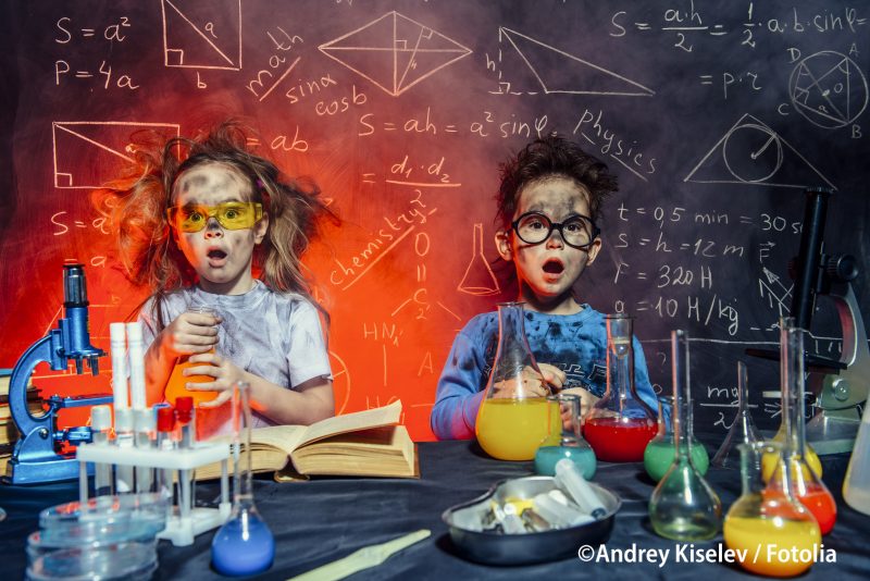 Funny little children doing experiments in the laboratory. Explosion in the laboratory. Science and education.